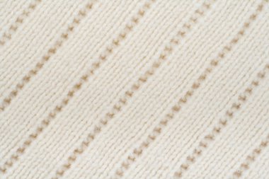 Süveter ya da atkı kumaş dokusu büyük örgü. Örülmüş forma ve kabartma desenli. Yün el yapımı makine, el yapımı.