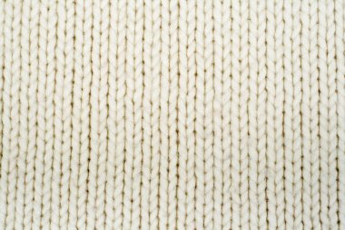 Süveter ya da atkı kumaş dokusu büyük örgü. Örülmüş forma ve kabartma desenli. Yün el yapımı makine, el yapımı.