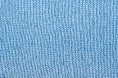 Süveter ya da atkı kumaş dokusu büyük örgü. Örülmüş forma ve kabartma desenli. Yün el yapımı makine, el yapımı.