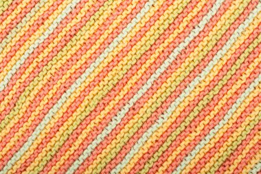 Süveter ya da atkı kumaş dokusu büyük örgü. Örülmüş forma ve kabartma desenli. Yün el yapımı makine, el yapımı.