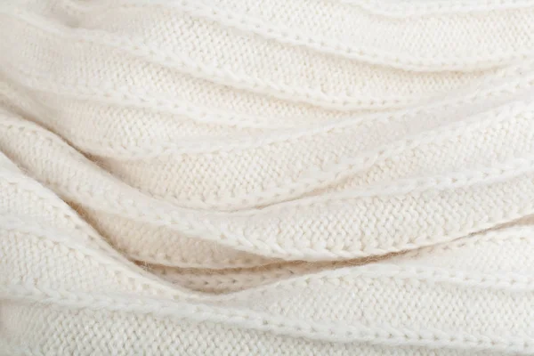 Süveter ya da atkı kumaş dokusu büyük örgü. Örülmüş forma ve kabartma desenli. Yün el yapımı makine, el yapımı.