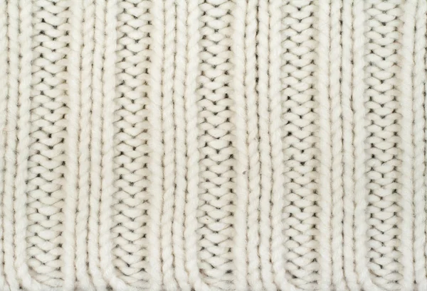 セーターやスカーフ生地のテクスチャ大編み物 レリーフパターンのニットジャージの背景 編み物で編組 ウールハンドマシン ハンドメイド — ストック写真