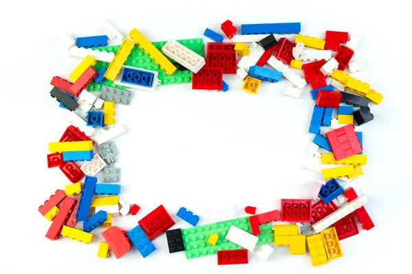 Lot of colorful rainbow toy bricks background. Educational toy for children Isolated on white background. 3D Rendering. Top view with copy space
