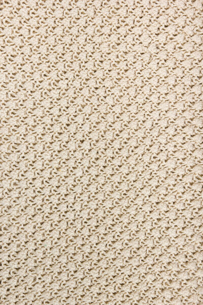 Свитер или ткань шарфа текстура большого вязания. Вязаный джерси фон с рельефным рисунком. Шерстяная ручная машина, ручная работа