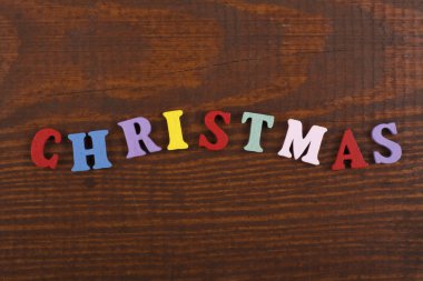 Noel kelime ahşap arka plan üzerinde renkli abc alfabe blok ahşap harfler, reklam metni için kopya alanı üzerinden oluşur. Öğrenme İngilizce kavramı.