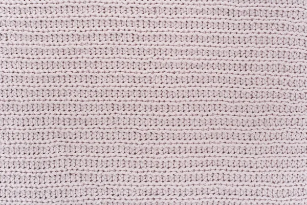 Süveter ya da atkı kumaş dokusu büyük örgü. Örülmüş forma ve kabartma desenli. Yün el yapımı makine, el yapımı..