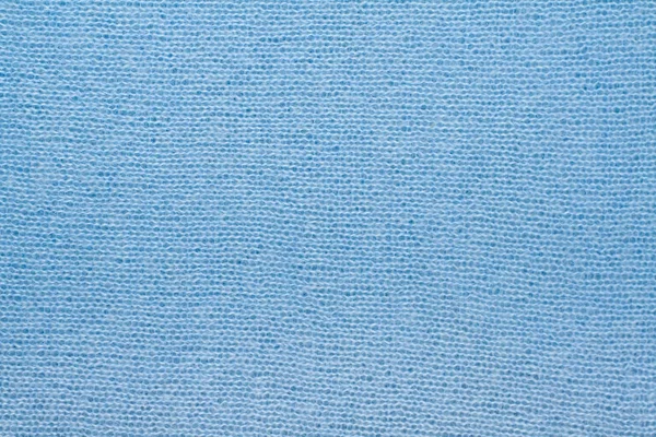 Pull ou écharpe tissu texture grand tricot. Fond en jersey tricoté avec un motif en relief. Laine à la main machine, fait main, bleu . — Photo