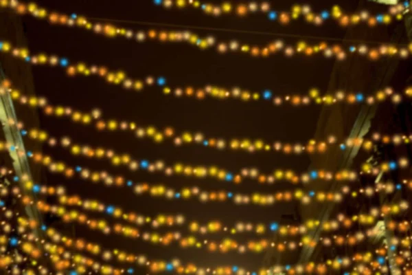 Abstract blur. street illumination. Christmas holidays, festive bulbs. — Stock Photo, Image