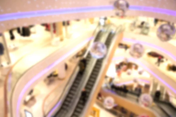 Bevásárlóközpont, áruház, modern kereskedelmi épület belső, elvont homályos háttér. — Stock Fotó