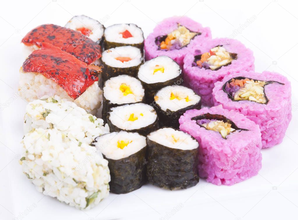 various type of sushi on a wnite plate