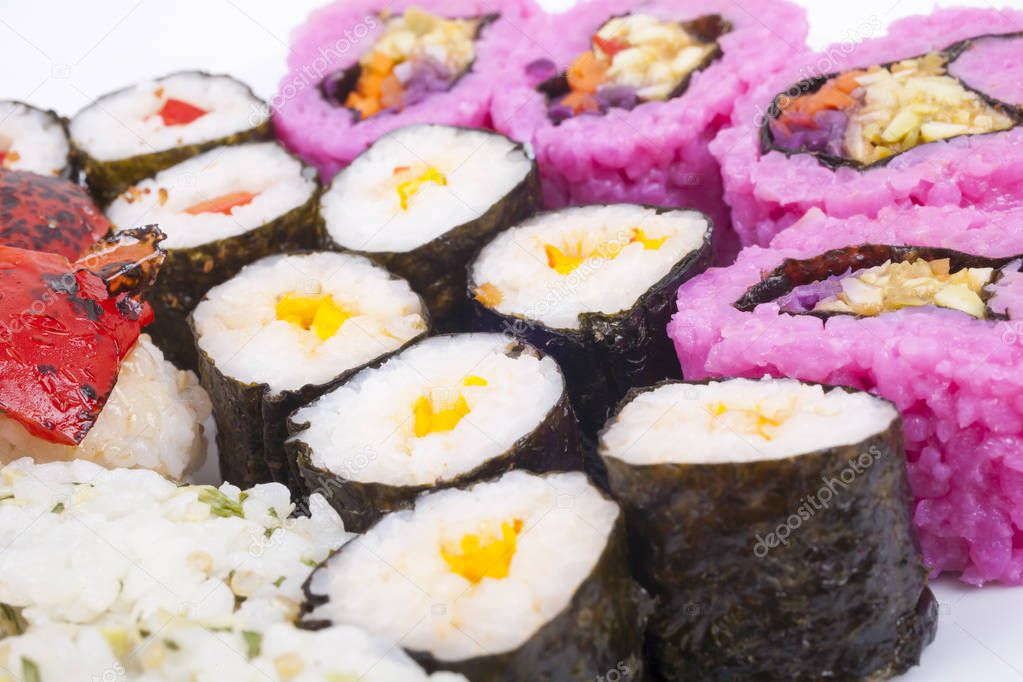 various type of sushi on a wnite plate