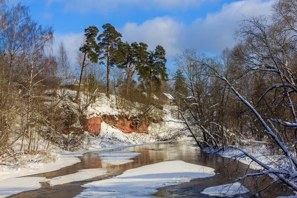 March rustic landscape on the river. River in spring. The Village in Russia