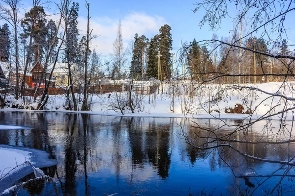 March rustic landscape on the river. River in spring. The Village in Russia