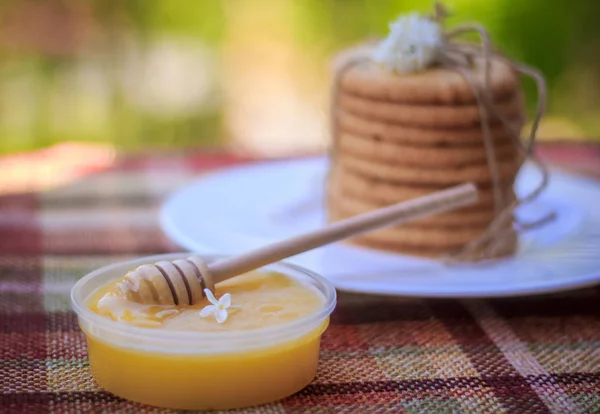 Spoon for honey with honey