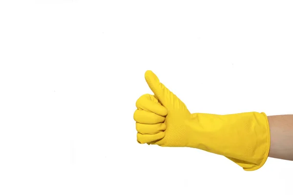 ように黄色のゴム手袋のバッジ 指でシンボルをドラッグします 重いジェスチャーです 白い背景に分離 — ストック写真