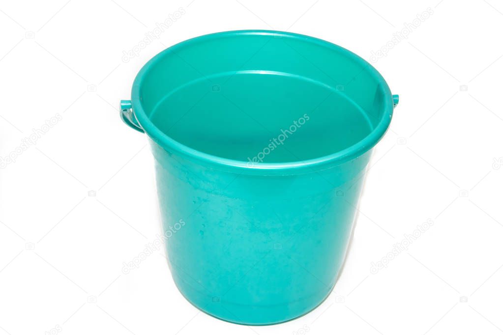 A bucket on a white background. Plastic green bucket on a white background. Bucket for washing floors. Cleaning bucket