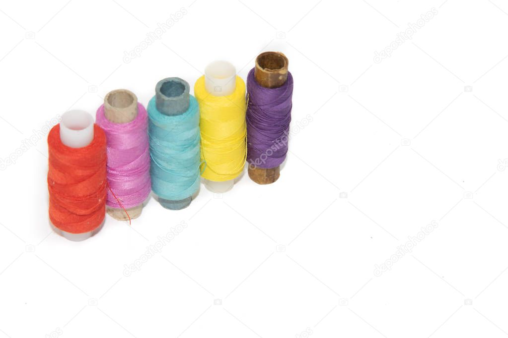 colored thread on white background. items for embroidery. handmade