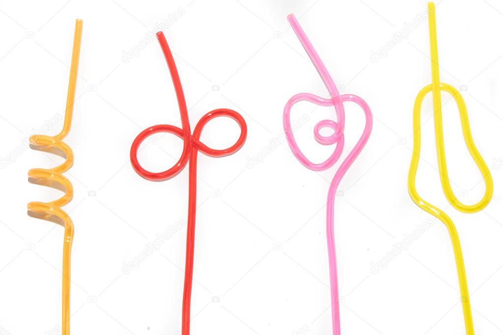Colored straws for cocktail isolated on white background. To drink a cocktail. colored plastic food. Decorating a glass with a cocktail. Beverages