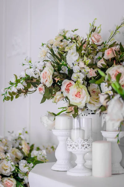 Wedding bouquet of white roses in a vase. Wedding decorations. White Rose. Wedding Attributes