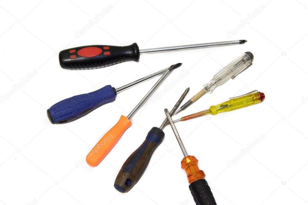 screwdriver on a white background. A set of tools for collecting furniture. Male tool kit.