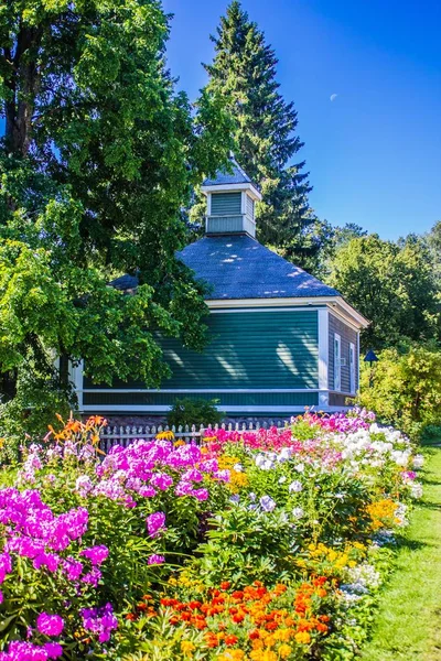 house with flowers in garden at daytime
