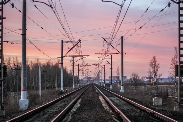 railway at sunset public transport. transportation of people and freight. travel around cities and countries