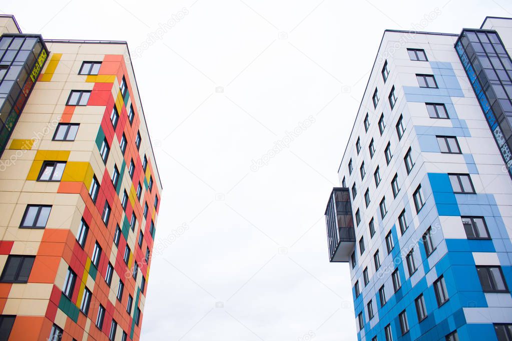 view of colorful high multi-storey residential buildings