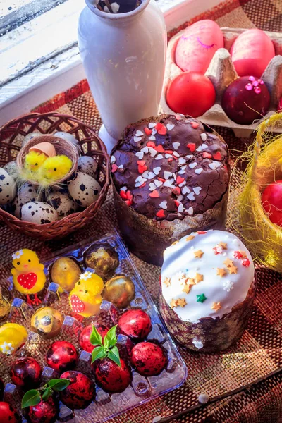 Postcard Happy Easter. Congratulations on a religious holiday. Orthodox holiday. Painted Easter eggs and traditional sugar-topped Easter cakes