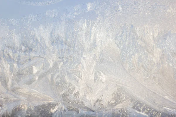 Frosty Pattern on the window in winter. Winter background