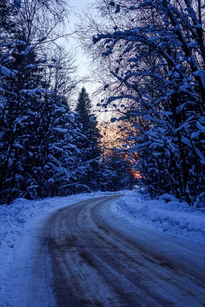 Snowy winter road. Travel by car