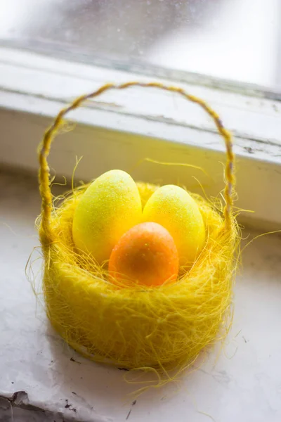 Postcard Happy Easter. Congratulations on a religious holiday. Orthodox holiday. Painted Easter eggs in basket