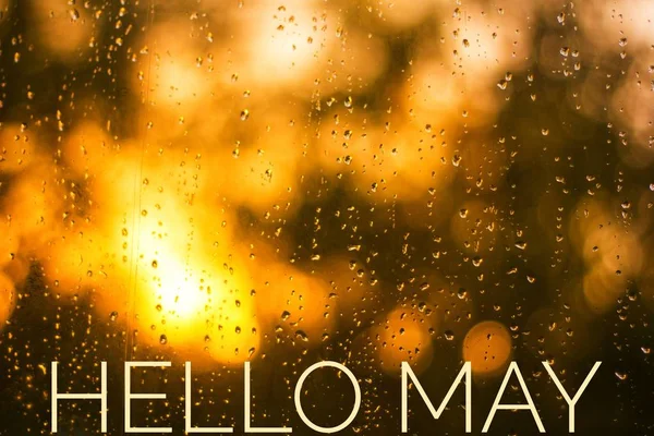 Banner Hello May. Greeting the new month. Hi spring. The text in the picture of the sunset. Evening sunset Sunset.