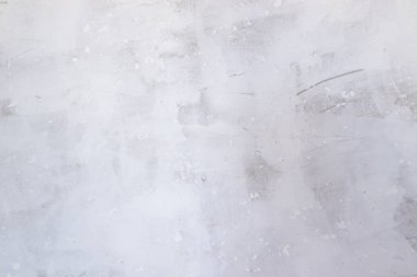 Macun ile Doku beton duvar. İnce bir macun tabakası. Gri duvarda beyaz macun. Duvar dokusu