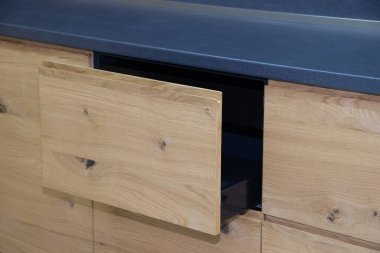 Wooden drawer in the kitchen. Drawers with closers. Modern kitchen.
