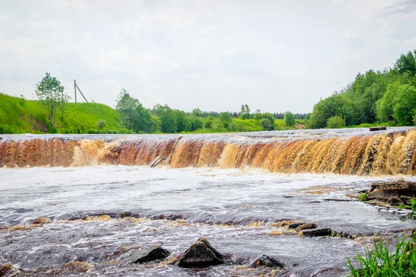 Sablinsky waterfalls. Little waterfall. The brown water of the waterfall.. Thresholds on the river. Strong water flow. Jets of water. Fast current