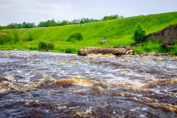 Sablinsky waterfalls. Little waterfall. The brown water of the waterfall.. Thresholds on the river. Strong water flow. Jets of water. Fast current