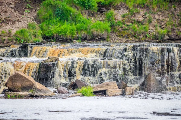 Sablinsky waterfalls. Little waterfall. The brown water of the waterfall.. Thresholds on the river. Strong water flow. Jets of water. Fast current