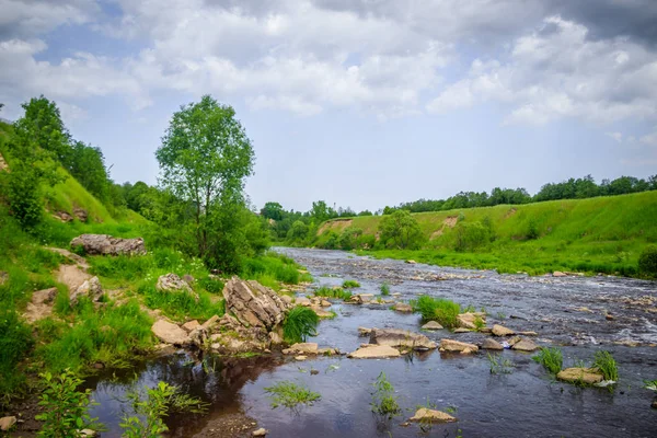 Sablinsky waterfalls. Little waterfall. The brown water of the waterfall.. Thresholds on the river. Strong water flow. Jets of water. Fast current