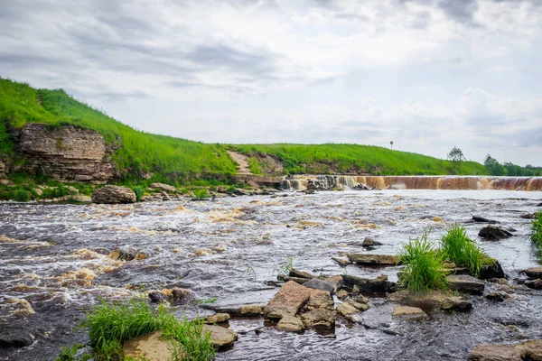 Sablinsky waterfalls. Little waterfall. The brown water of the waterfall.. Thresholds on the river. Strong water flow. Jets of water. Fast current