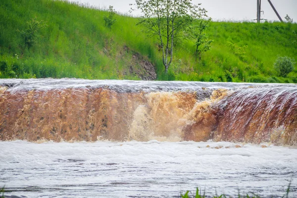 Sablinsky waterfalls. Little waterfall. The brown water of the waterfall.. Thresholds on the river. Strong water flow. Jets of water. Fast current