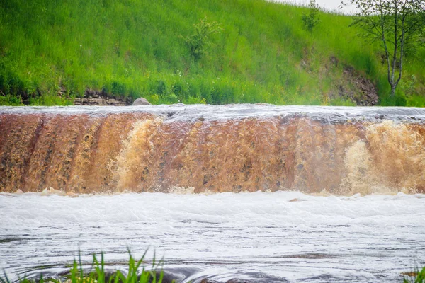 Sablinsky waterfalls. Little waterfall. The brown water of the waterfall.. Thresholds on the river. Strong water flow. Jets of water. Fast current