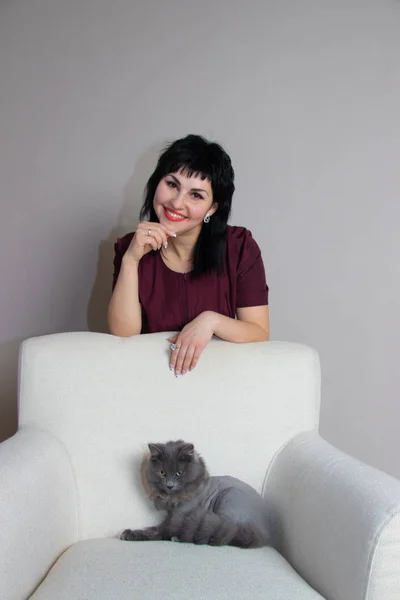 beautiful  woman in medical suit with grey cat