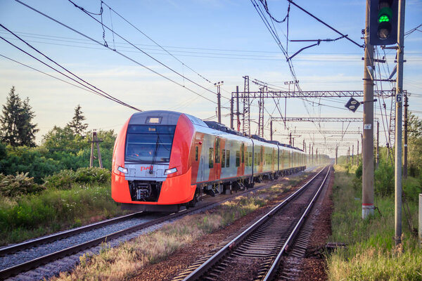 Russian train on the railway. Summer railway. Rails and sleepers. Russia, Suyda June 19, 2019