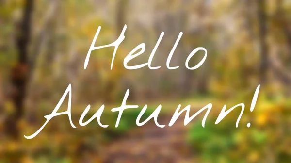 Banner hello autumn. New month. Greeting card. Golden autumn. Autumn in the park. The text in the photo. Trees in the autumn park.