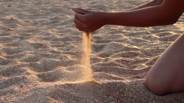 Boy Pouring Sand Hands Beach — Stockvideo