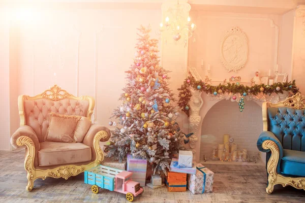 New Year's toys hang on a Christmas tree. Christmas tree decoration. New Year's and Christmas. — Stock Image New Year's toys hang on a Christmas tree. Christmas tree decoration. New Year's and Christmas. Royalty Free Stock Images