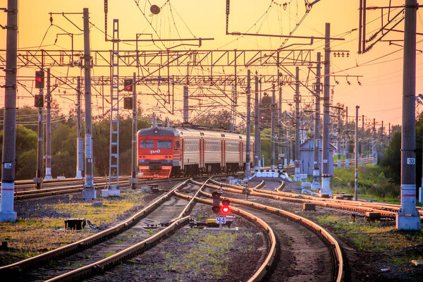 Russia, Lyuban - August 15, 2019: Summer railway of Russia, iron path, sunset background 