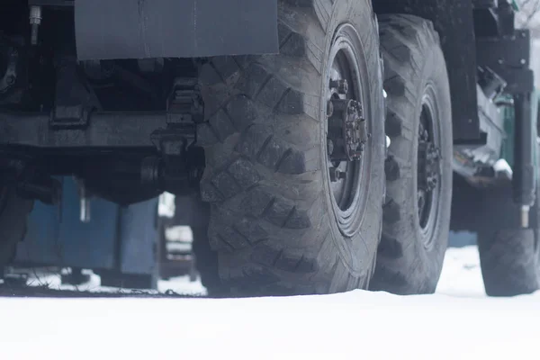 Trucks wheel in winter time close up