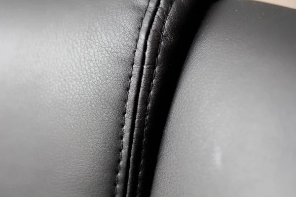 Part of the leather chair close-up. Leather chair with a seam — Stock Photo, Image