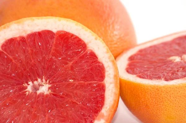 Slices of grapefruit macro closeup on white background — Stock Photo, Image